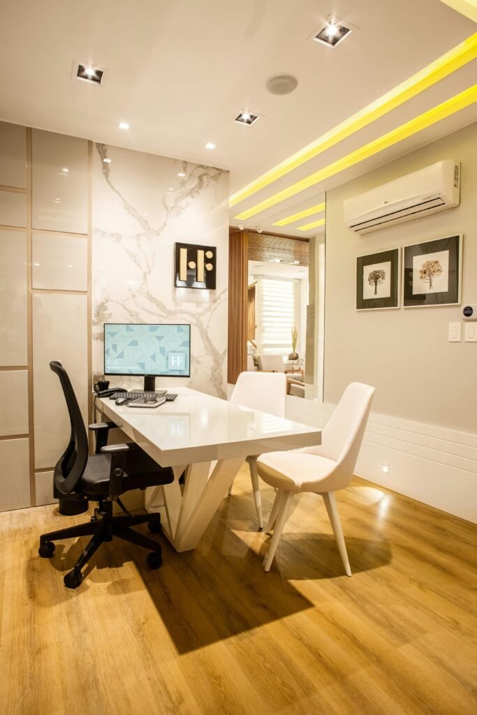 pexels-photo-3316924-3316924-1 Elegant modern office interior featuring a sleek desk, chairs, and ambient lighting for a sophisticated environment.